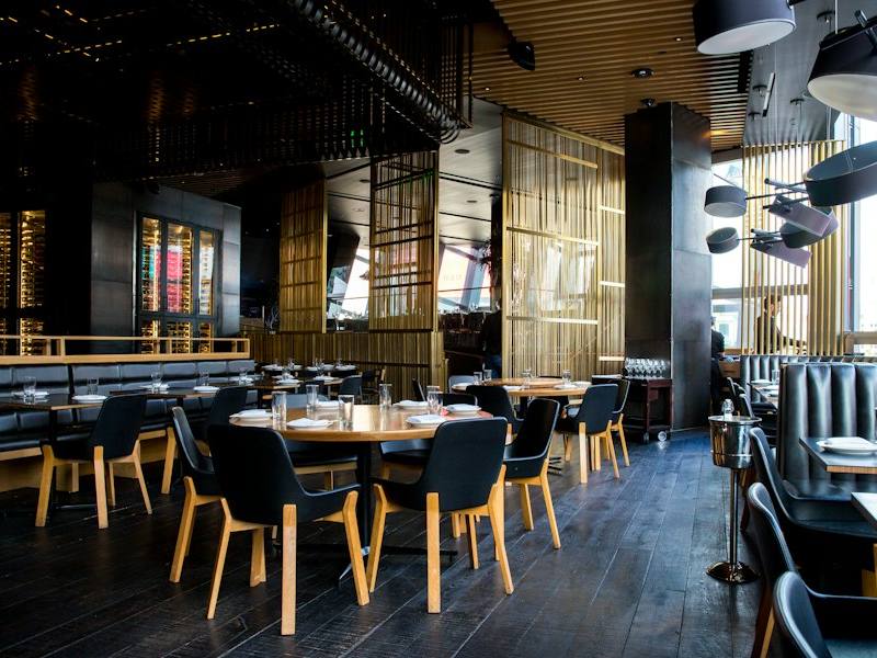 Restaurant dining room with set tables and chairs