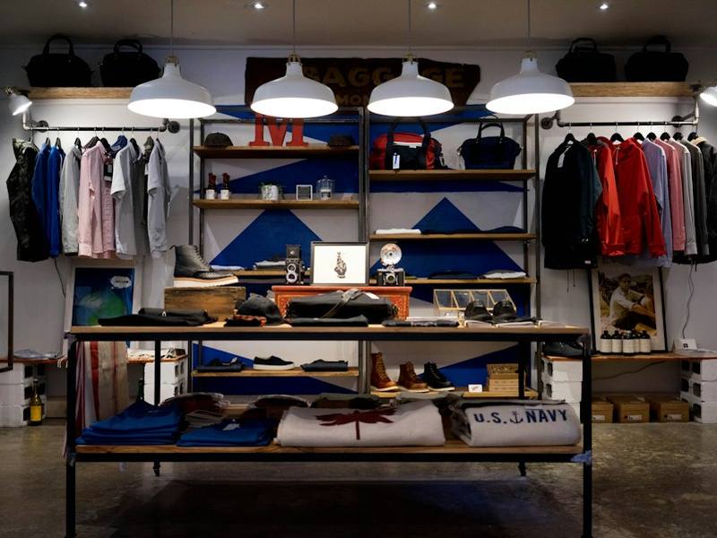 Retail clothing store interior with stocked shelves